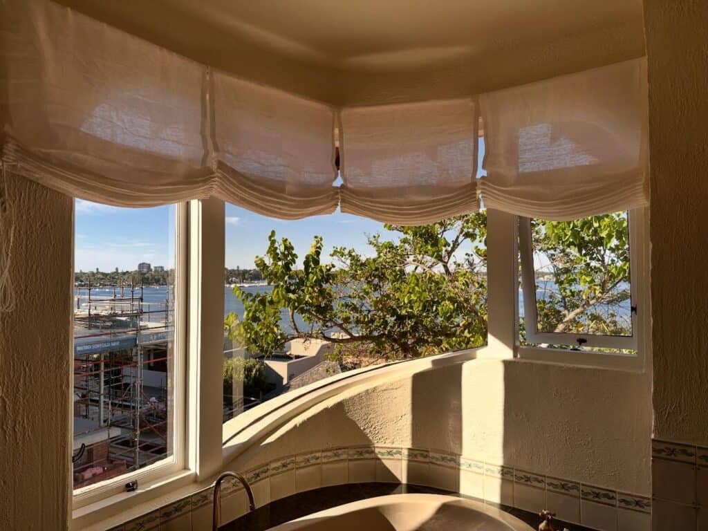 Relaxed Roman blinds raised in a Perth household