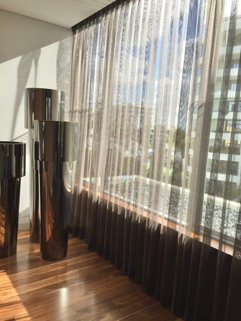 Sheer curtains filtering daylight in a Perth home