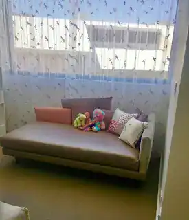 Sheer curtains filtering morning light in a child's bedroom in Perth