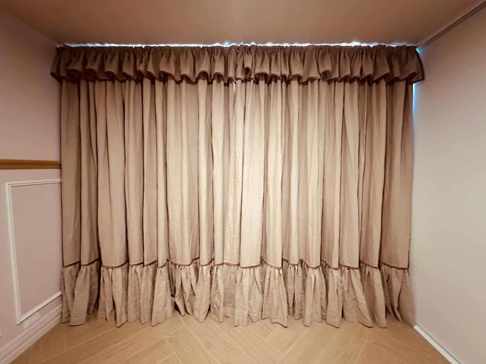 Blockout curtains with a frilled heading and hem in a girl's bedroom in Perth