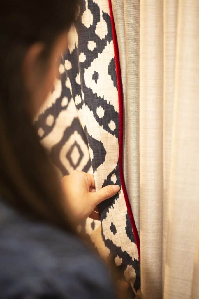 Close-up of patterned curtain fabric with contrast trim detail