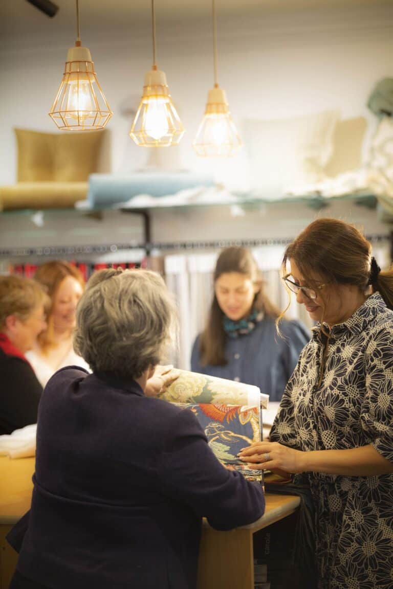 Reviewing curtain fabric samples during a showroom consultation