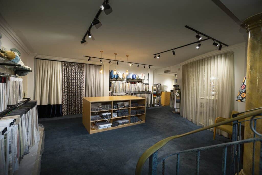 Curtain fabric displays and sample library inside the Hay Interiors showroom