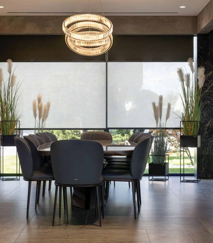Double roller blinds with sunscreen and blockout fabrics on one bracket