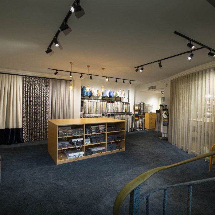 Curtain fabric displays and sample library inside the Hay Interiors showroom