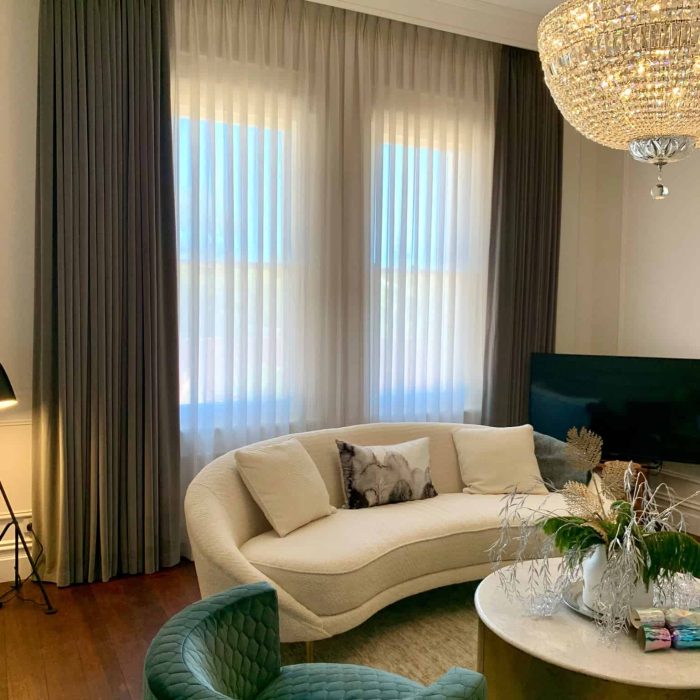 Sheer curtains layered behind blockout curtains in a Perth home